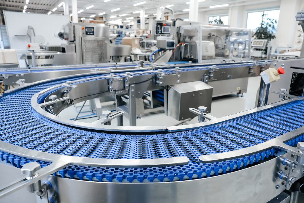 Empty modern conveyor belt of production line, part of industrial equipment in factory plant. Automatic system line
